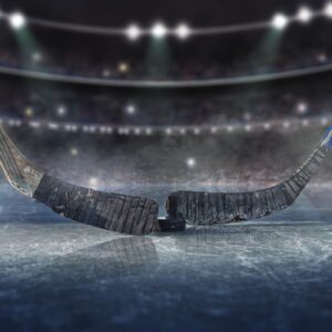 Hockey sticks face off on ice